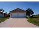 Detached two-car garage with white doors, offering ample parking and storage space at 29211 Picador St, Punta Gorda, FL 33982