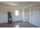 Clean and well-lit garage featuring white walls, a convenient exit door, and a modern water heater, adding functionality and storage at 29211 Picador St, Punta Gorda, FL 33982