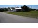 Multiple garages on street side with driveways, offering ample parking and storage for vehicles and outdoor equipment at 29211 Picador St, Punta Gorda, FL 33982