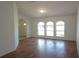 Bright and spacious living room featuring hard wood floors and white interior at 29211 Picador St, Punta Gorda, FL 33982