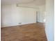 Spacious room with laminate flooring and white walls offering a bright and neutral living space at 29211 Picador St, Punta Gorda, FL 33982