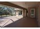 Large covered patio featuring tile flooring and views of the surrounding greenery at 29211 Picador St, Punta Gorda, FL 33982