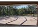 Spacious screened patio surrounded by lush trees and foliage, offering a serene outdoor living space at 29211 Picador St, Punta Gorda, FL 33982