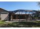 Enclosed back patio with a screened-in enclosure perfect for enjoying the outdoors at 29211 Picador St, Punta Gorda, FL 33982