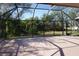 View of the screened-in lanai offering a tranquil outdoor space with views of the surrounding landscape at 29211 Picador St, Punta Gorda, FL 33982