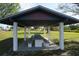 Community picnic area with a covered shelter and a large picnic table with benches at 29211 Picador St, Punta Gorda, FL 33982