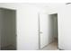 A bright empty room featuring white walls, light-colored floors, and two doors leading to other areas at 29211 Picador St, Punta Gorda, FL 33982