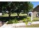 Spacious yard with mature trees, offering plenty of room for outdoor activities at 29211 Picador St, Punta Gorda, FL 33982