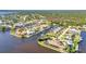 Picture-perfect waterfront homes with private boat docks surrounded by lush landscapes at 3016 Curry Ter, Port Charlotte, FL 33981