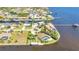 Waterfront property featuring a backyard swimming pool and private boat dock access at 3016 Curry Ter, Port Charlotte, FL 33981