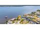 Aerial view of waterfront home with lush landscaping and private dock at 3016 Curry Ter, Port Charlotte, FL 33981