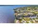 Aerial view showcasing homes nestled along waterfront canals with private boat docks at 3016 Curry Ter, Port Charlotte, FL 33981