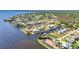 Aerial view of waterfront neighborhood with canal access and beautiful homes at 3016 Curry Ter, Port Charlotte, FL 33981