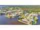 Aerial view of waterfront neighborhood with canal access and beautiful homes at 3016 Curry Ter, Port Charlotte, FL 33981