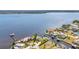 Scenic aerial view of waterfront homes with boat docks and lush greenery at 3016 Curry Ter, Port Charlotte, FL 33981