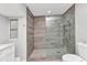 This is a bathroom with a shower that has stone-look tile and glass door at 3016 Curry Ter, Port Charlotte, FL 33981