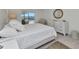 Serene bedroom with a comfortable bed, dresser, and sliding glass doors to enjoy outdoor views at 3016 Curry Ter, Port Charlotte, FL 33981