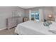 Bright bedroom featuring a ceiling fan, a slider to the pool, and neutral decor at 3016 Curry Ter, Port Charlotte, FL 33981