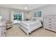 Bright bedroom featuring a ceiling fan, a slider to the pool, and neutral decor at 3016 Curry Ter, Port Charlotte, FL 33981