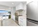 Bright kitchen featuring stainless steel appliances, marble backsplash, oven range and water views at 3016 Curry Ter, Port Charlotte, FL 33981