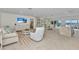 Open floor plan featuring a living room, dining area and kitchen with water views at 3016 Curry Ter, Port Charlotte, FL 33981
