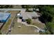 Aerial view of a landscaped property with a brick patio and fenced yard at 3051 Chicory Ter, Punta Gorda, FL 33983