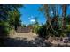 Serene backyard setting with lush landscaping and privacy fencing at 3051 Chicory Ter, Punta Gorda, FL 33983