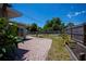 Private backyard featuring a brick patio, seating, and a fire pit at 3051 Chicory Ter, Punta Gorda, FL 33983