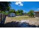 Large backyard with a shed and a mature tree line, fully fenced at 3051 Chicory Ter, Punta Gorda, FL 33983