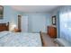 A well lit bedroom with two windows, a double closet, and traditional furnishings at 3051 Chicory Ter, Punta Gorda, FL 33983