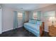 Cozy bedroom with windows and dark tiled floors at 3051 Chicory Ter, Punta Gorda, FL 33983