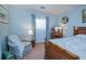 Comfortable bedroom showcasing vintage furniture, a plush chair, and a large window at 3051 Chicory Ter, Punta Gorda, FL 33983