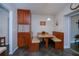 Cozy breakfast nook with a built-in booth and wood cabinets at 3051 Chicory Ter, Punta Gorda, FL 33983