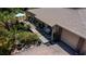 Exterior of home featuring meticulously landscaped yard with a serene pond and a dock, shaded by mature trees at 3051 Chicory Ter, Punta Gorda, FL 33983