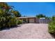 Charming single-story home with brick driveway and tropical landscaping under a clear blue sky at 3051 Chicory Ter, Punta Gorda, FL 33983