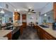 Open kitchen featuring tile floors, wood cabinets, and a cozy breakfast nook at 3051 Chicory Ter, Punta Gorda, FL 33983