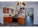 Kitchen with tile floors, granite countertops, wood cabinets and stainless appliances at 3051 Chicory Ter, Punta Gorda, FL 33983