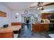Eat-in kitchen with dark wood cabinets, ceiling fan and breakfast nook at 3051 Chicory Ter, Punta Gorda, FL 33983