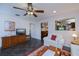 Cozy living room featuring a ceiling fan and warm interior decor at 3051 Chicory Ter, Punta Gorda, FL 33983