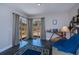 Bright living room with access to the deck through sliding doors and a stylish blue area rug at 3051 Chicory Ter, Punta Gorda, FL 33983