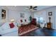 Inviting living room featuring comfortable seating, a ceiling fan, and stylish decor at 3051 Chicory Ter, Punta Gorda, FL 33983
