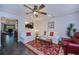 Relaxing living room with neutral walls, ceiling fan, comfortable sofas, and a view of the kitchen at 3051 Chicory Ter, Punta Gorda, FL 33983