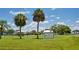 A serene park with palm trees and a clear sign reading Harbour Heights Park at 3051 Chicory Ter, Punta Gorda, FL 33983