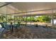 Relaxing covered porch includes a dining table and view of the backyard at 3175 Lakatos St, North Port, FL 34286