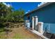 Side exterior view of home showing utilities and landscaping at 3175 Lakatos St, North Port, FL 34286