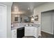 Kitchen featuring a corner sink and adjacent to the dining area with natural lighting at 3175 Lakatos St, North Port, FL 34286