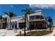A commercial property features a cafe with outdoor seating and large storefront windows at 3175 Lakatos St, North Port, FL 34286