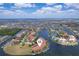 Beautiful aerial view of waterfront homes with boat docks nestled along canals and bays under a cloudy sky at 3334 Purple Martin Dr # 214, Punta Gorda, FL 33950