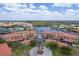 Stunning aerial view of community featuring lush landscaping, pool, waterways, and well-maintained grounds at 3334 Purple Martin Dr # 214, Punta Gorda, FL 33950