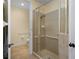 Modern bathroom features a tiled shower with a glass door and grab bars for accessibility at 3334 Purple Martin Dr # 214, Punta Gorda, FL 33950